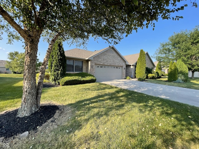 view of front facade with a garage, a front yard, brick siding, and driveway