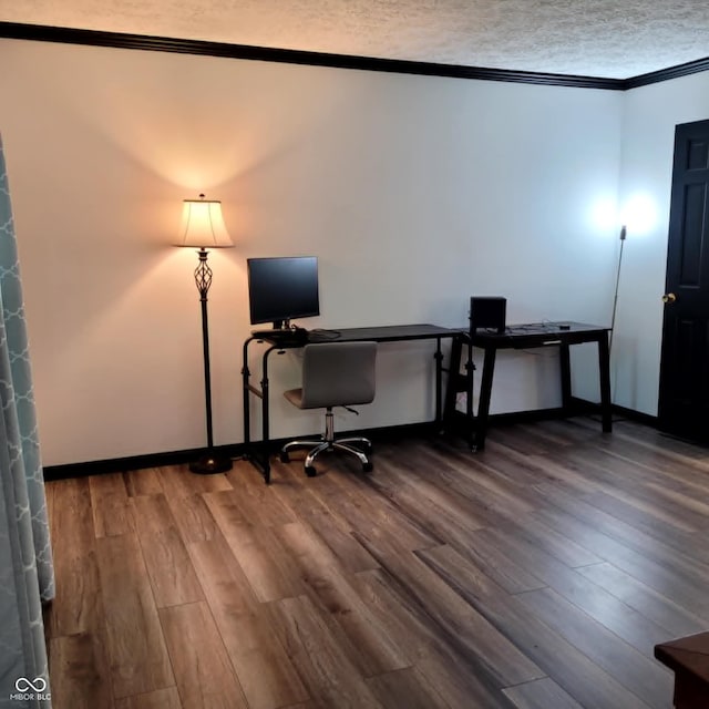 home office with wood-type flooring, crown molding, and a textured ceiling