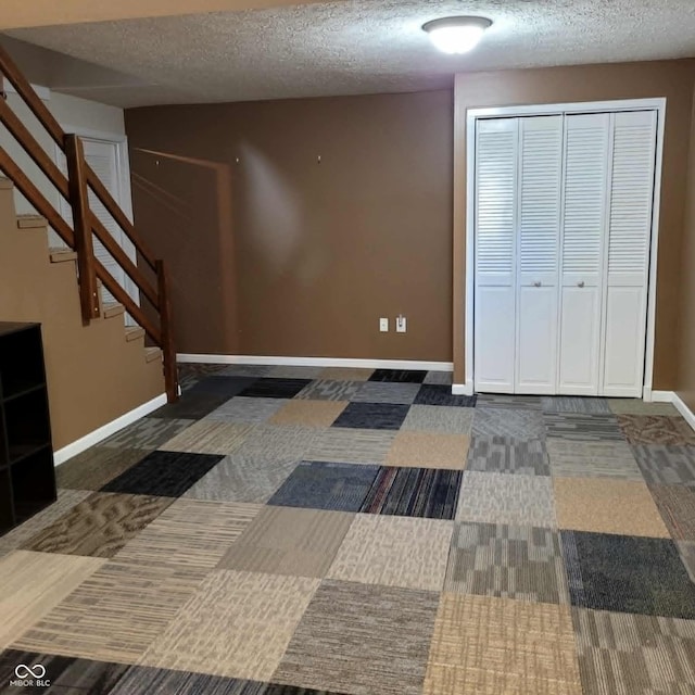 interior space featuring a textured ceiling