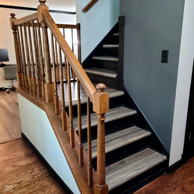 stairway with wood-type flooring