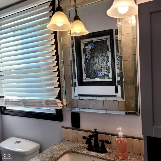 bathroom featuring sink and toilet