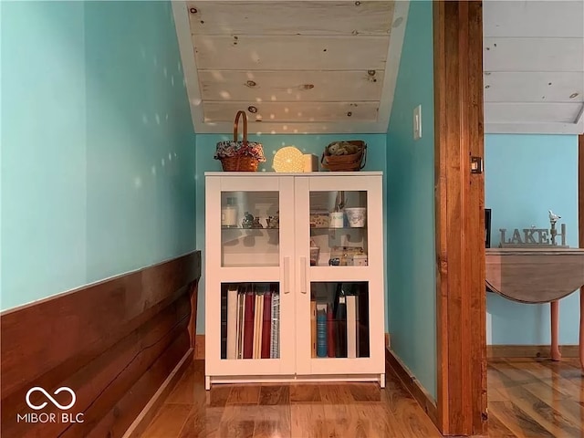 view of sauna featuring hardwood / wood-style flooring and wooden ceiling