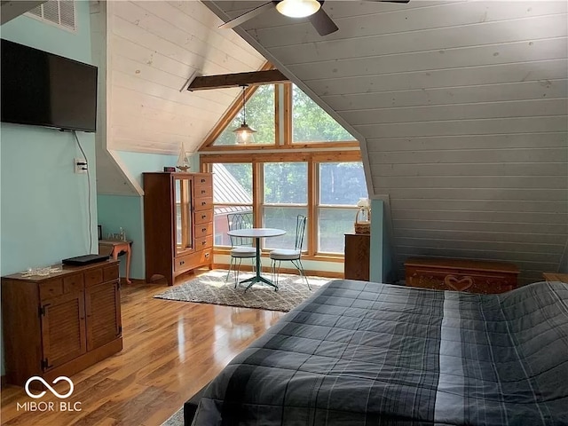 bedroom featuring light wood-type flooring, ceiling fan, and lofted ceiling