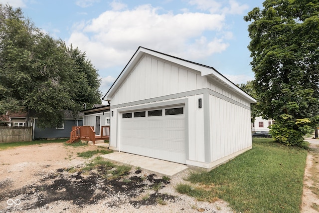 garage featuring a lawn