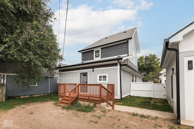 back of property featuring a wooden deck