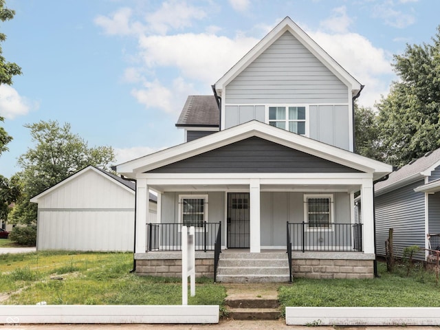 view of front of house with a front lawn and covered porch