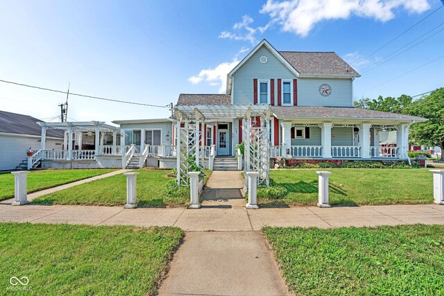 farmhouse-style home featuring a front lawn and a porch