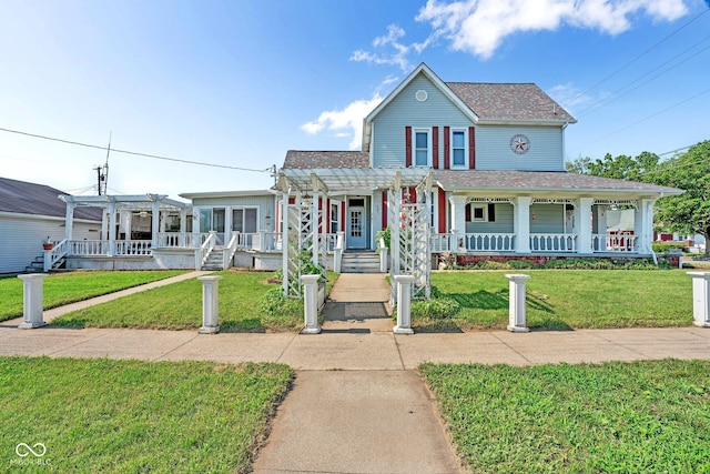 farmhouse inspired home with a porch, a front yard, and a pergola