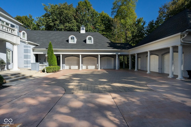 8358 Hidden Point Dr, Indianapolis, IN 46256 - view of front of house with driveway, a garage, and roof with shingles