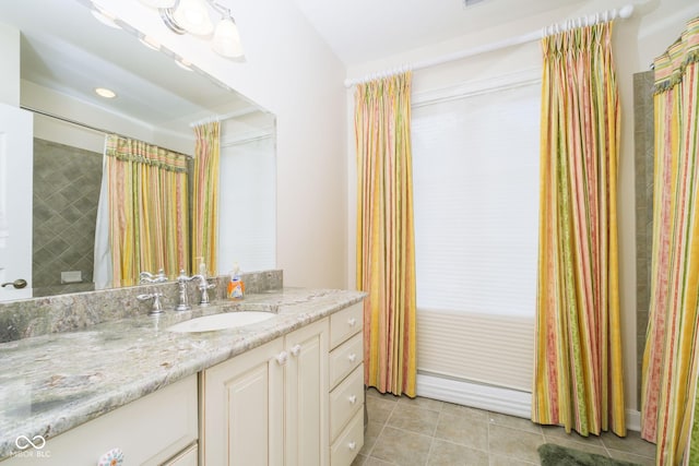 bathroom with tile patterned floors and vanity