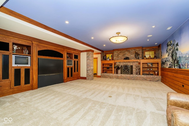 8358 Hidden Point Dr, Indianapolis, IN 46256 - unfurnished living room with carpet, built in shelves, recessed lighting, decorative columns, and a fireplace