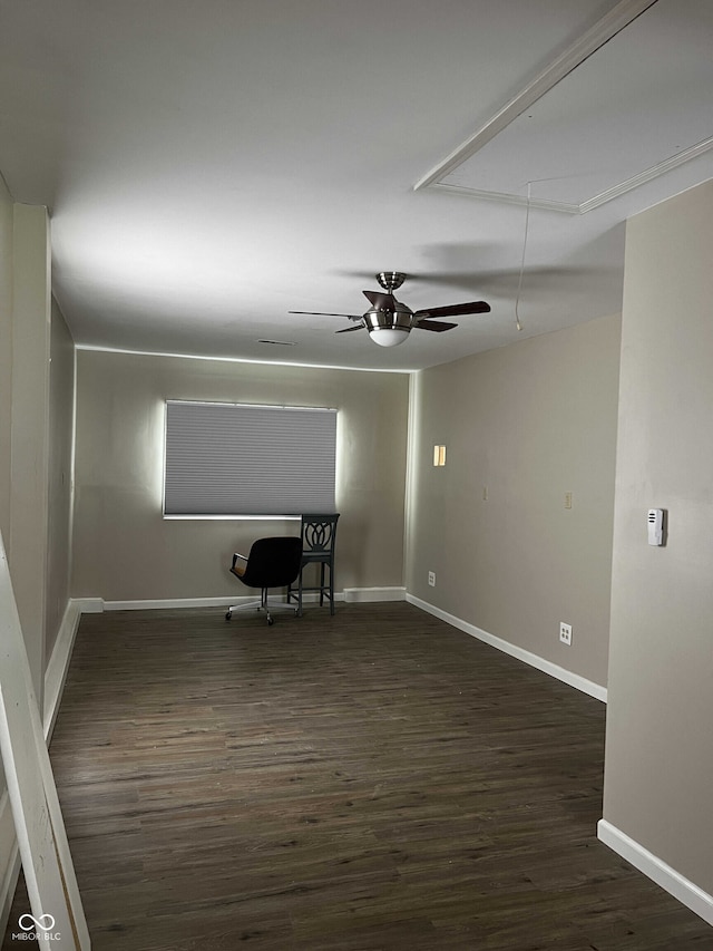 unfurnished room with ceiling fan and dark hardwood / wood-style flooring