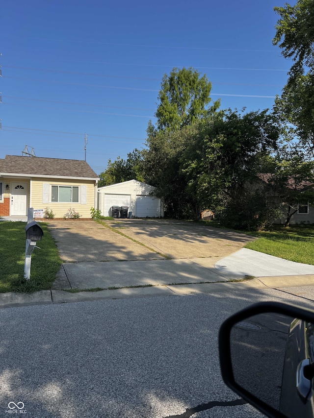 view of front of property with an outbuilding and a garage