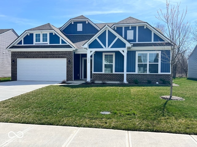 view of front of house featuring a front yard and a garage