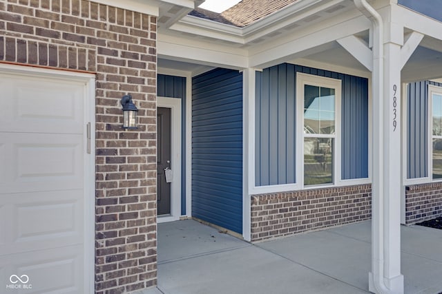 doorway to property featuring a garage