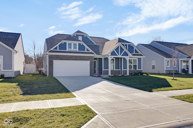 craftsman house featuring a garage and a front yard