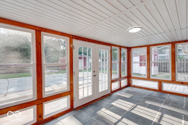 unfurnished sunroom with french doors