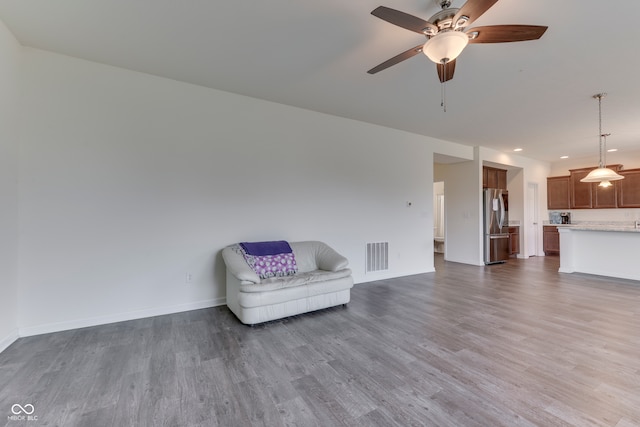 unfurnished room featuring ceiling fan and dark hardwood / wood-style floors