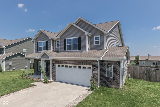 view of front of home with a garage and a front yard