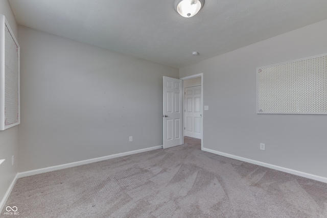 unfurnished bedroom with light carpet