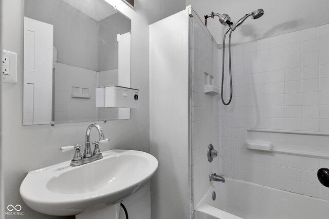 bathroom featuring a sink and shower / washtub combination