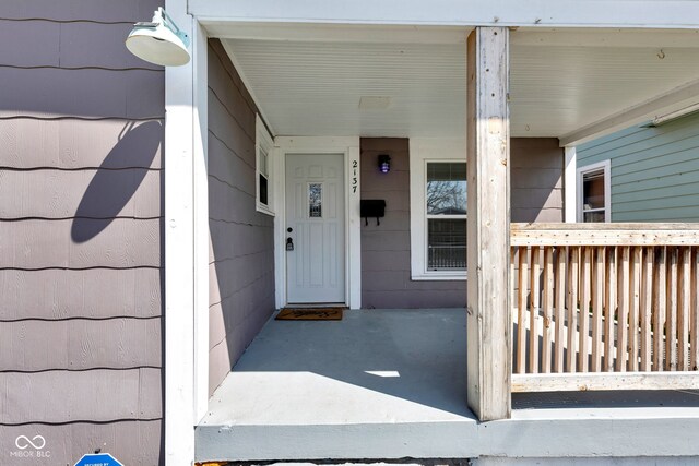 doorway to property with covered porch