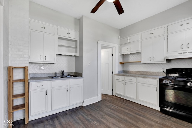 kitchen with gas stove, under cabinet range hood, open shelves, and ceiling fan