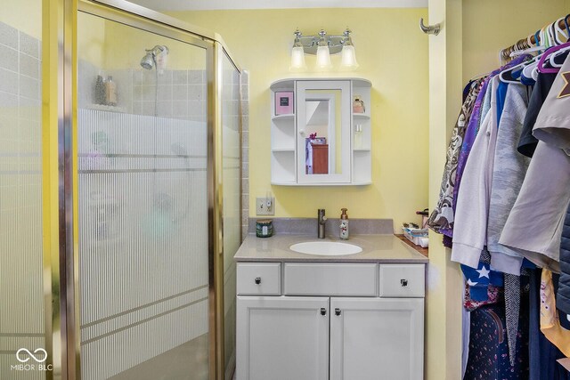 bathroom with vanity and walk in shower