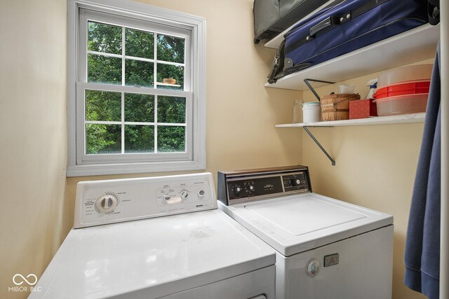 laundry room with washer and clothes dryer and a wealth of natural light