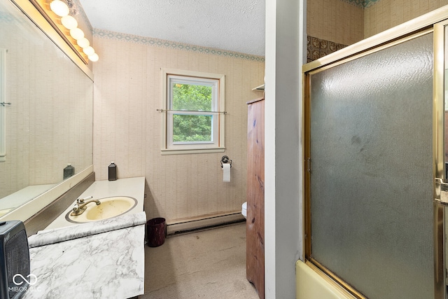 full bathroom featuring combined bath / shower with glass door, a textured ceiling, toilet, vanity, and a baseboard heating unit