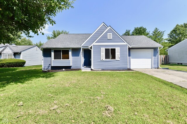 ranch-style home with a front lawn and a garage