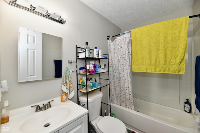 full bathroom with vanity, toilet, shower / bath combination with curtain, and a textured ceiling