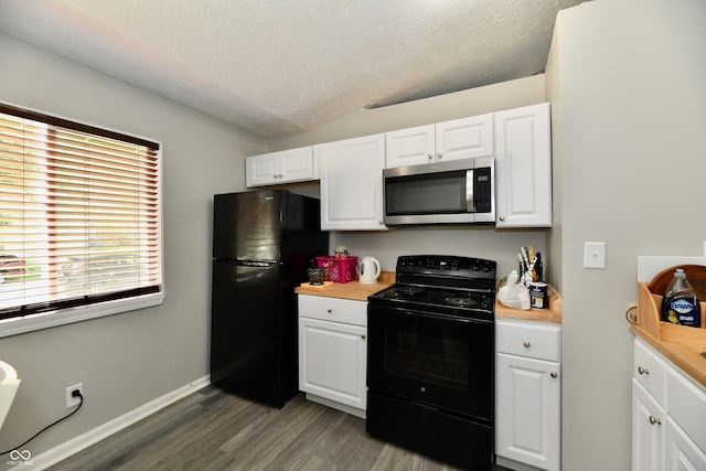 kitchen featuring black appliances, white cabinets, a textured ceiling, and hardwood / wood-style floors