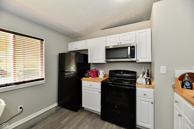 kitchen with light countertops, white cabinets, black appliances, a textured ceiling, and dark wood finished floors