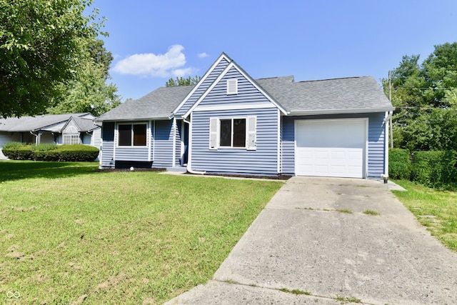 single story home with a front yard and a garage