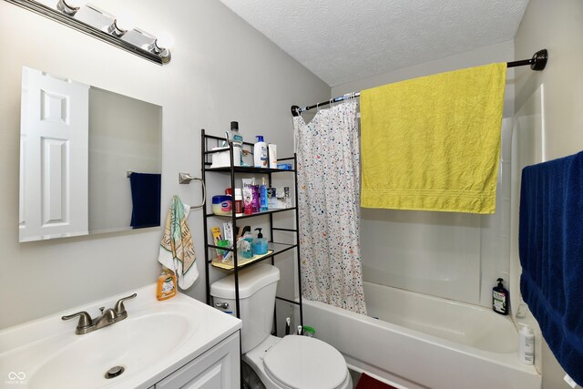 full bathroom featuring shower / bathtub combination with curtain, a textured ceiling, toilet, and vanity