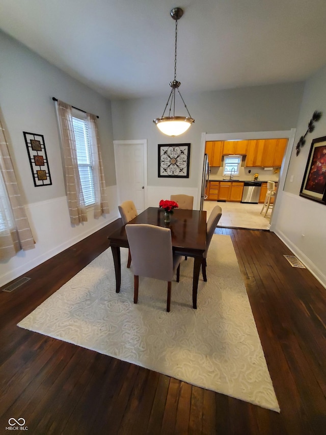 dining room featuring dark hardwood / wood-style flooring