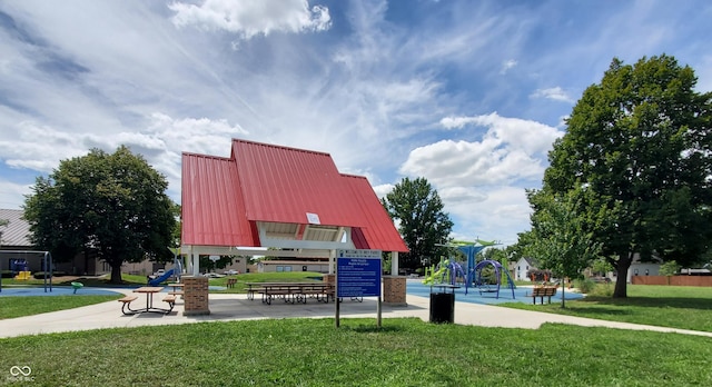 view of home's community with a yard and a playground