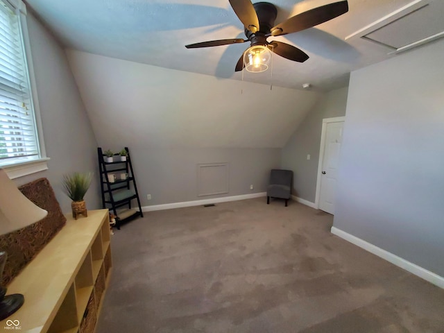 additional living space with lofted ceiling, ceiling fan, and carpet flooring