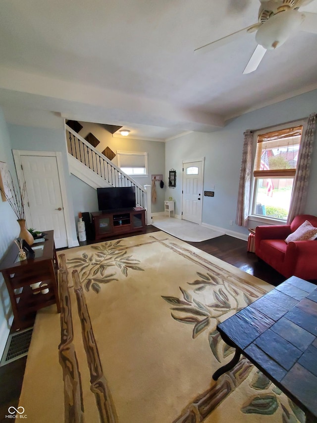 unfurnished living room with ceiling fan