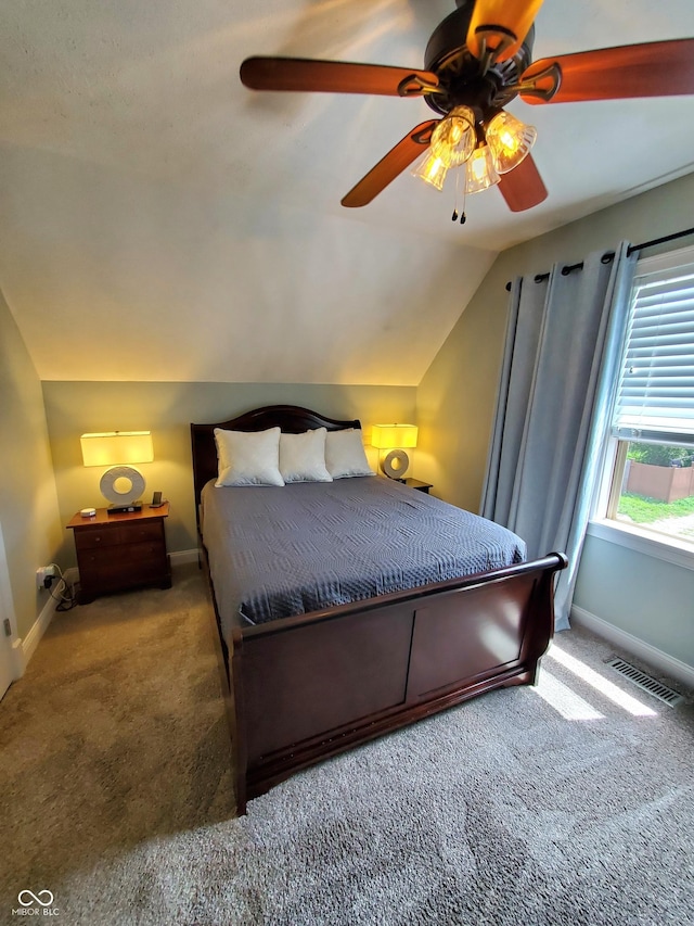 carpeted bedroom with lofted ceiling and ceiling fan