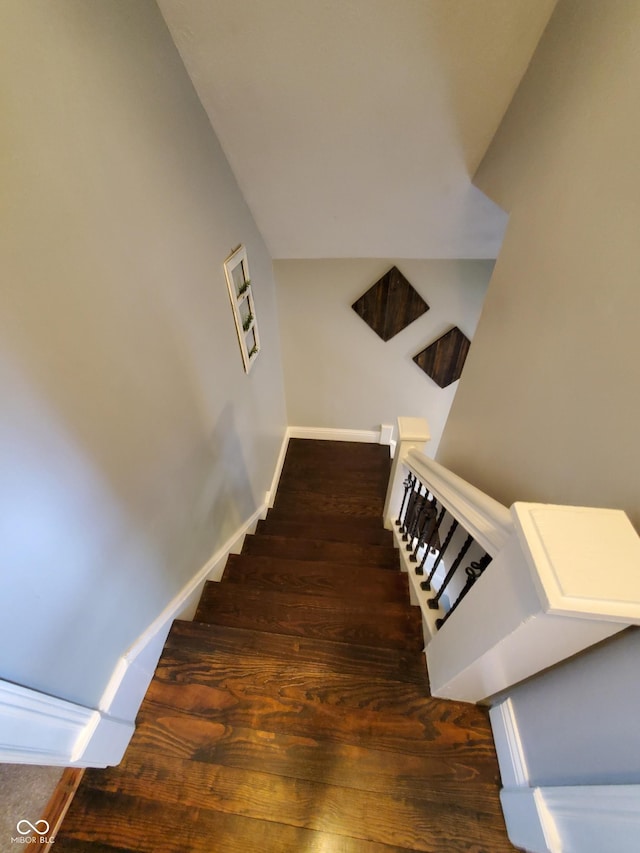 stairs with hardwood / wood-style floors