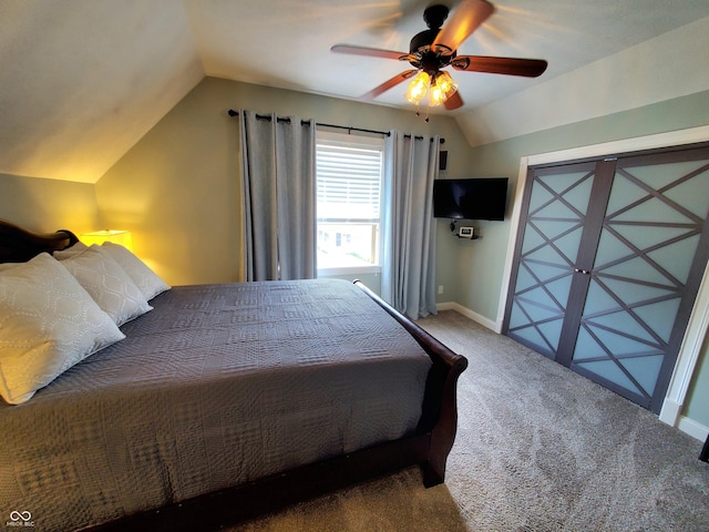 bedroom with ceiling fan, lofted ceiling, and carpet