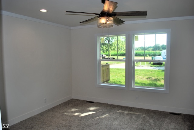 carpeted empty room featuring ceiling fan