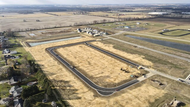 birds eye view of property with a rural view