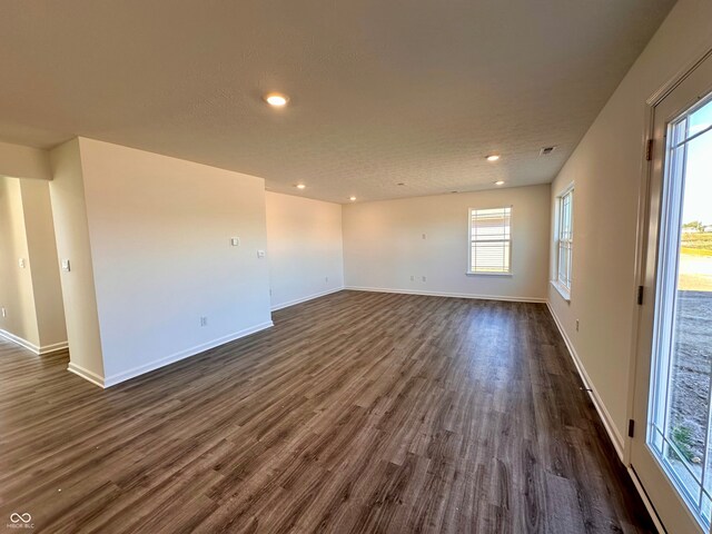 1126 Fleming Dr, Greenfield, IN 46140 - spare room with dark wood-type flooring, baseboards, and recessed lighting