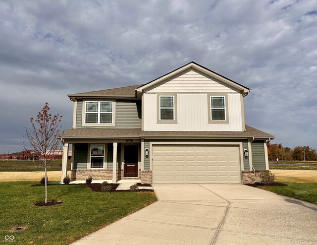 1126 Fleming Dr, Greenfield, IN 46140 - craftsman-style house with covered porch, driveway, brick siding, and a garage