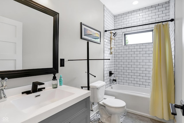 full bathroom with vanity, shower / tub combo with curtain, and toilet