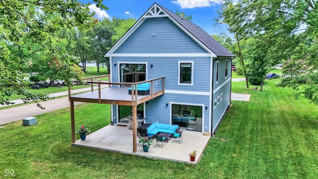 back of house featuring a patio area and a yard