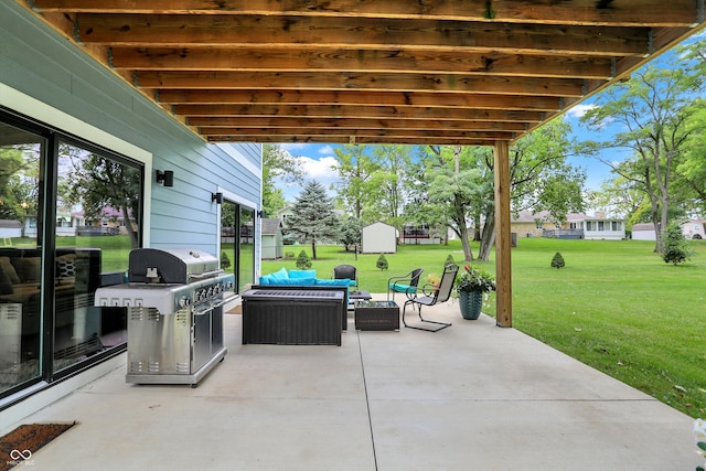 view of patio / terrace featuring a storage shed, an outdoor hangout area, and grilling area